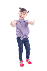 Little asian girl smiling and showing thumbs up while standing over white background
