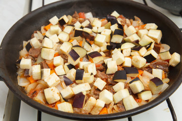 fry beef with carrots and eggplants