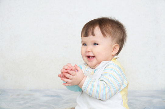 happy clapping hands cute smiling baby, caucasian blue eyes cheerful infant playing funny