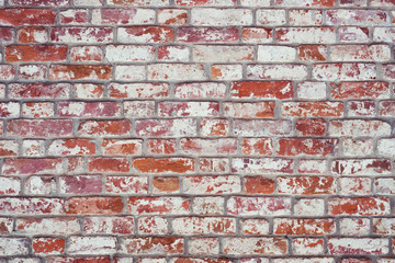 Brick wall, old texture of red stone blocks. Background.