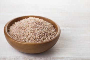 Raw pink rice in a bowl