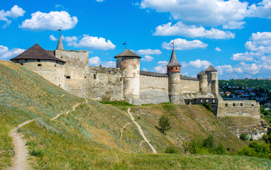 Photo of ancient stone castle with many hight towers in Kamyanets-Podilsky