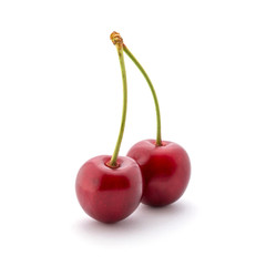 Photo of red cherries with tails isolated on white background