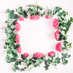 Flowers composition. Frame made of pink rose flowers on pink background. Flat lay, top view, copy space, square