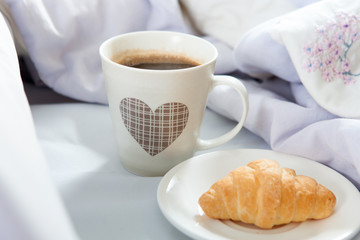 Bedroom on the bed, morning coffee. Valentine's Day. Happiness. A heart.