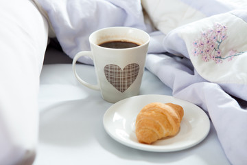 Bedroom on the bed, morning coffee. Valentine's Day. Happiness. A heart.