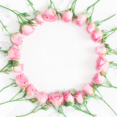 Obraz na płótnie Canvas Flowers composition. Wreath made of pink rose flowers on white background. Flat lay, top view, copy space, square