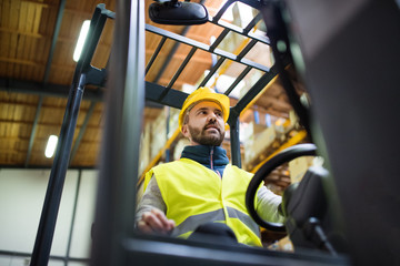 Warehouse man worker with forklift.