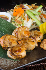 japanese cuisine. grilled shell fish on the background