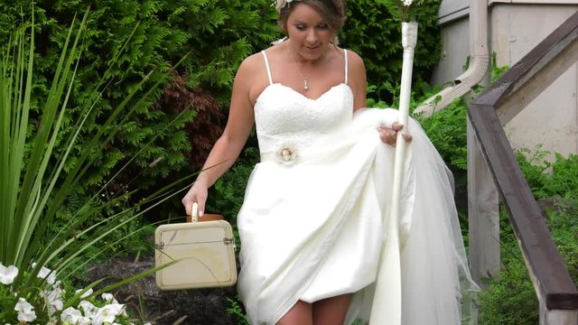 outdoors themed bride walks down stairs and smiles 4k