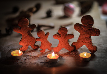 candles and gingerbread men at the Christmas table