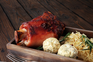 Roasted pork knuckle. Ham and bacon are popular foods in the west. German Schweinshaxe or Haxe