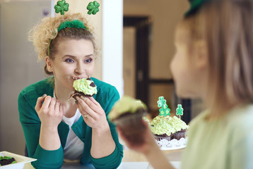 Woman eating tasty a cupcake