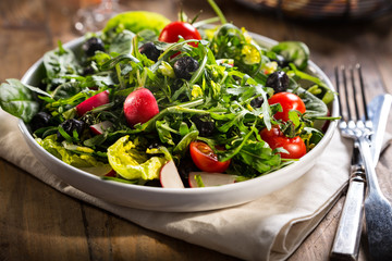 Green salad served on the plate.
