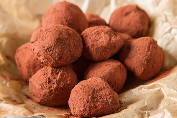 Fototapeta na wymiar Homemade chocolate truffles with cocoa powder. Copy space. Luxur