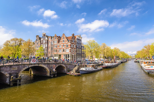 Amsterdam city skyline at canal waterfront, Amsterdam, Netherlands