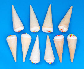 Small ice cream cone on a blue background.