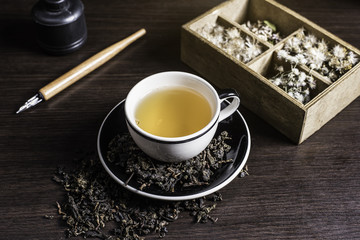 Tea on wood background.