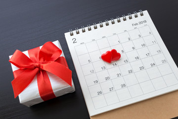 Hearts on calendar February 14 with gift