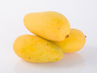 Naklejka na ściany i meble yellow mango fruit on a background