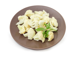 Frozen cauliflower with parsley on the brown dish