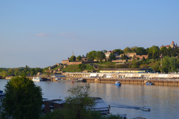 Fototapeta na wymiar Ships on the Sava River. The fortress Kalemegdan in the background