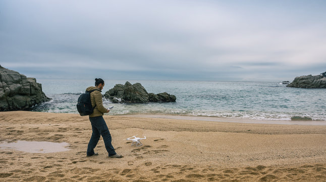 Man  testing its drone and recording videos