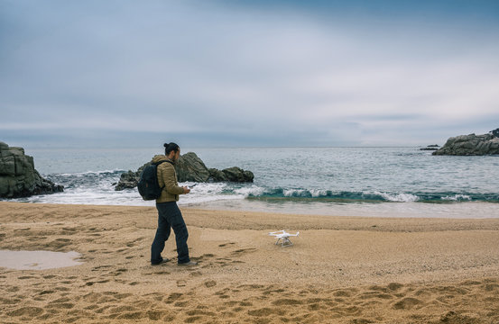 Man  testing its drone and recording videos