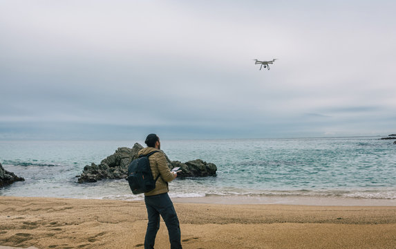 Man  testing its drone and recording videos