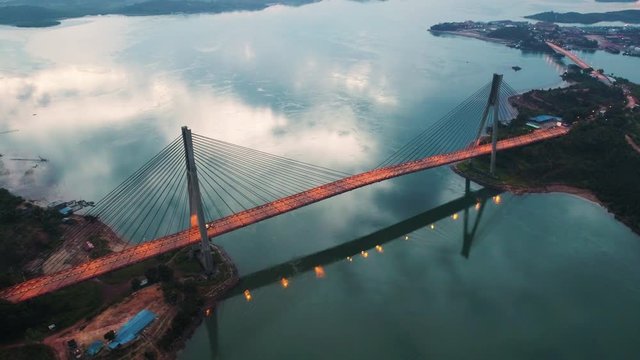Truck moving in Batam bridge also known as  Barelang Bridge at sunrise, Indonesia