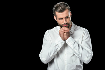 nervous businessman in white shirt, isolated on black