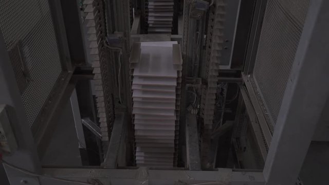 Production of ceramics, ceramic tiles are moving on the conveyor.
