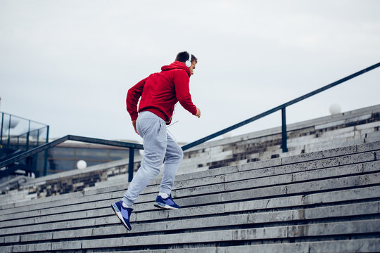 Handsome Man Running Up At Stairs