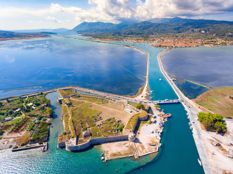Castle Santa Maura and the famous floating swing bridge in Lefkada island Greece. Lefkada City visible in the background