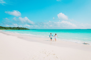 Fototapeta na wymiar happy loving couple enjoy tropical beach