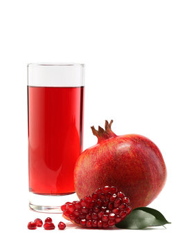 Glass of pomegranate juice and fruit isolated on white