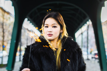 Asian Blond Girl with Sparkler - obrazy, fototapety, plakaty