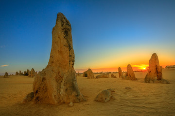 Giant limestone formation at dusk. The Pinnacles Desert in Nambung National Park, offers, at...