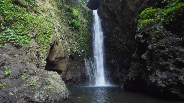 Cinemagraph - Waterfall in green rainforest. waterfall in the mountain jungle, Motion Photo. Bali,Indonesia. Travel concept.