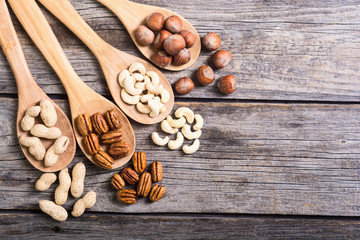 Mix of nuts in wooden spoon
