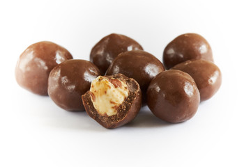 Chocolate balls filled with hazelnuts isolated on white background