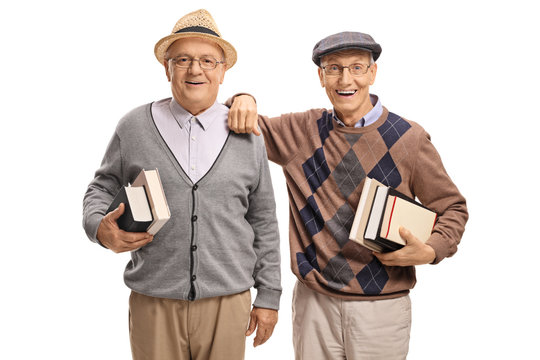 Seniors with books looking at the camera and smiling