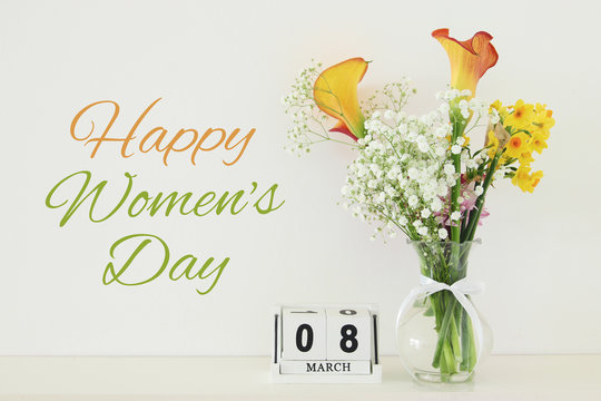 International Women Day Concept With Beautiful Flowers In The Vase And Date On Wooden Table.