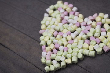 sweet heart shape of marshmallows on wood background, decoration for love and valentine day concept.