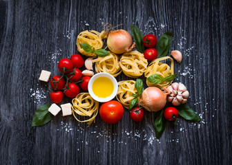 Top view of all the necessary food component to make a classic italian pasta