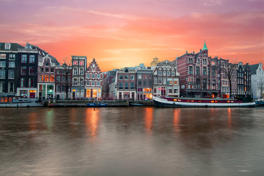 Amsterdam at the river Amstel at sunset in the Netherlands