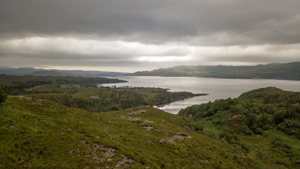 Fototapeta premium Loch Torridon, Scottish Highlands. An aerial view over the sea loch in the northwest of Scotland with the sun struggling to break through the clouds.
