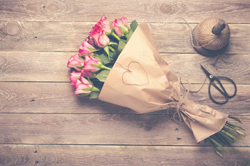 Bouquet of red roses on wooden background -  Vintage look