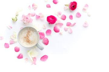 Romantic background with cup of coffee flowers over white table. Soft photo. Greeting card style. place for text, Top view flat lay with copy space for slogan or text