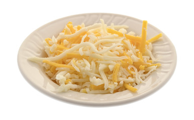 A blend of mozzarella and cheddar cheeses for pizza topping in a small bowl isolated on a white background.